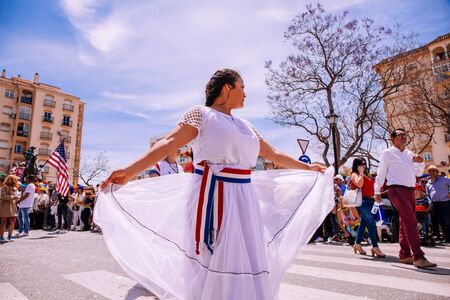 25th INTERNATIONAL VILLAGES FAIR in Fuengirola. The multicultural parade, in which all the delegations at each edition of? FIP? take part Andalusia, Spain. Picture taken? 1 May 2019.のeditorial素材