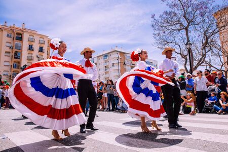 25th INTERNATIONAL VILLAGES FAIR in Fuengirola. The multicultural parade, in which all the delegations at each edition of? FIP? take part Andalusia, Spain. Picture taken? 1 May 2019.のeditorial素材