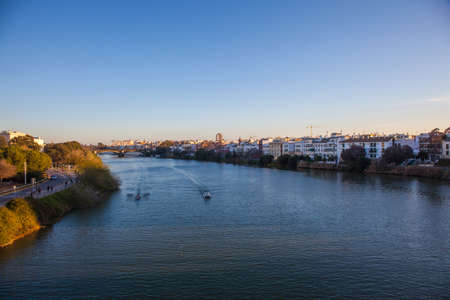 Guadalquivir River. Panoramic view of the waterfront of the Guadalquivir River in Seville, Andalusia, Spain. Picture taken 22 March 2020.のeditorial素材