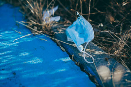 Medical face mask on the floor in the street.の写真素材