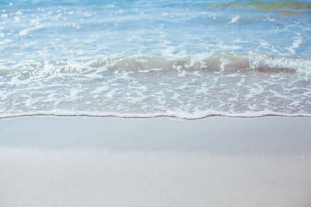 Soft blue ocean wave on sandy beach. Background.の写真素材
