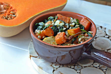 roasted pumpkin with pearl barley, spinach and creamy blue cheeseの写真素材