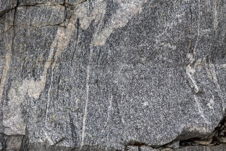 major stone texture and background. Quarry overgrown with moss