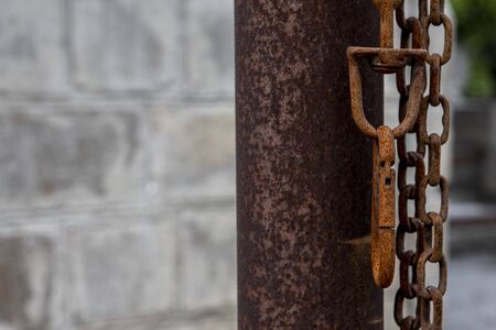 rusty metal chain and carabiner. A leash for guard dogs