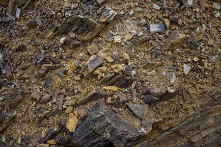 the background and rough dark stone texture closeupの写真素材