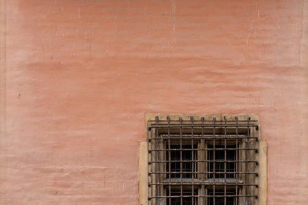 Old window on the wall of an old building with cの写真素材