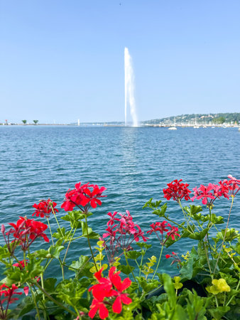 Lake Geneva with fountain and red flowers. Lake Geneva is the largest lake in Switzerland.の写真素材