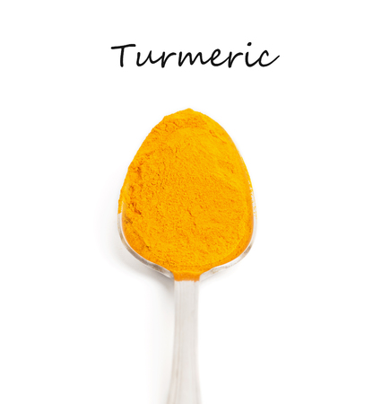Curcuma in iron spoon isolated on white background with text. の写真素材