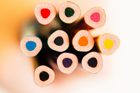 Color pencils bottom in hand isolated on white background. Close up. View from above.の写真素材