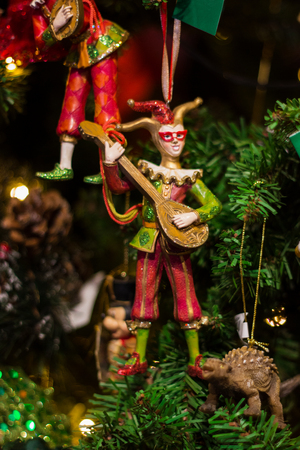 Christmas and New Year's Day festive decoration, wooden Christmas multicolored toy on Christmas tree.の写真素材