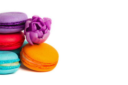 Cake macaron or macaroon isolated on white, colorful almond cookies, pastel colors, violet spring...