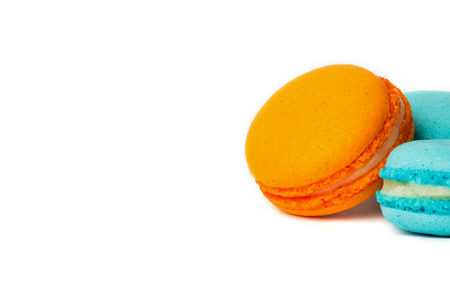 Cake macaron or macaroon isolated on white, colorful almond cookies, pastel colors. Copy space for text.の写真素材