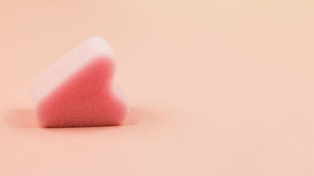 Close up of menstrual sponge tampon on pink background with copy space for text. Feminine hygiene product, View from above.の写真素材