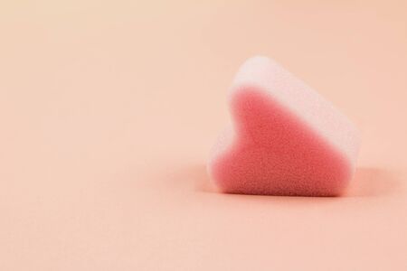 Close up of menstrual sponge tampon on pink background with copy space for text. Feminine hygiene product, View from above.の写真素材