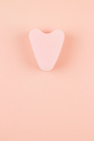 Close up of menstrual sponge tampon on pink background with copy space for text. Feminine hygiene product, View from above.の写真素材