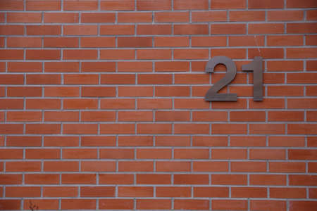 House number 21 sign on wallの写真素材