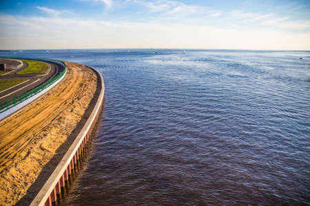 construction of a road along the river in the cityの写真素材