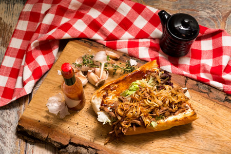 New Orleans Roast Beef Debris Po Boy sandwich. Slow Cooked Roast Beef stew filling, fried onion chips and a hot sauce.の写真素材