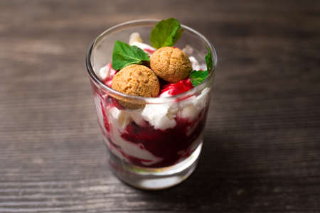 Strawberry parfait with cookies and garnished with mint leavesの写真素材