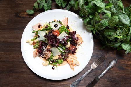 portion of salad with trout (salmon, red fish meat) and grapefruit and cashews. top view.の写真素材