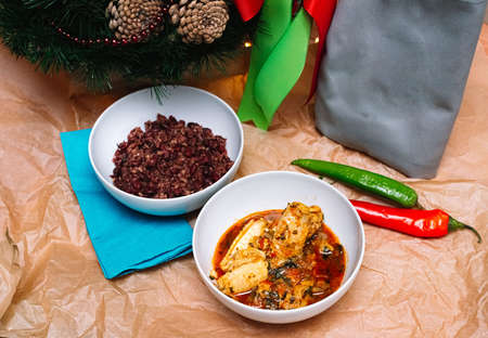 two servings of Georgian dishes. a deep plate of chakhohbili - a traditional Georgian dish of chicken with herbs. a deep plate of lobio - a dish of red beans.の写真素材