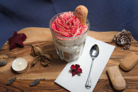 Whipped cream dessert with savoiardi cookies and raspberry sprinklesの写真素材