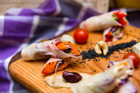 spring rolls on a wooden board, beautifully decorated appetizers