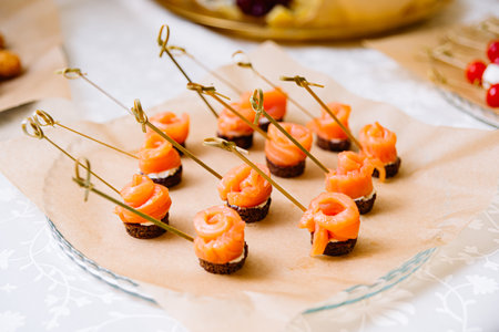 Smoked Salmon Canapes with Cream Cheese on Rye Bread for Cateringの写真素材