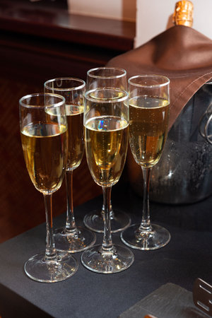 A sophisticated arrangement of champagne glasses ready for a celebratory toast. the setting essence...