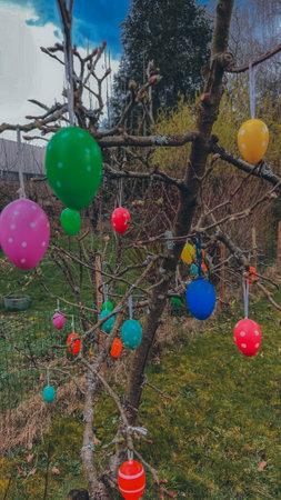 Easter joy blossoms around a tree adorned with vibrant Easter eggs, radiating the spirit of...