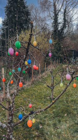 Easter joy blossoms around a tree adorned with vibrant Easter eggs, radiating the spirit of...