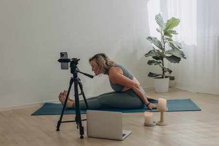 A 50-year-old woman doing online yoga at home