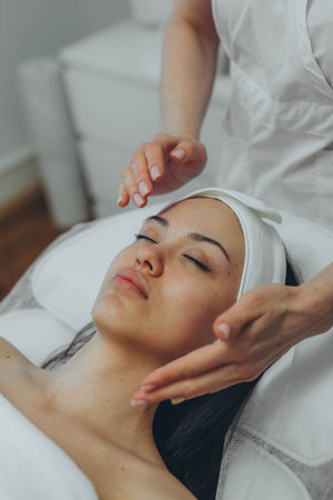 girl at a cosmetologists office doing skin cleansing