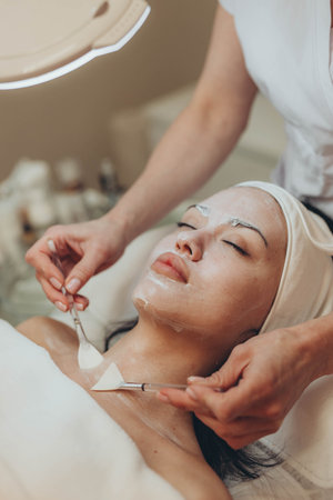 A girl at a cosmetologist does cosmetic procedures. Skin cleansing