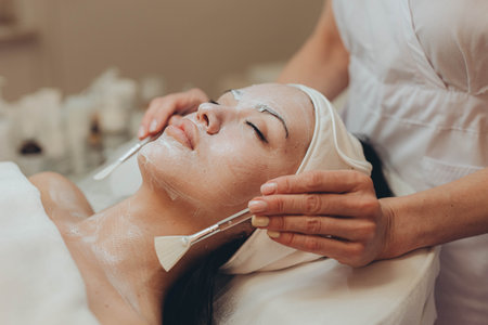 A girl at a cosmetologist does cosmetic procedures. Skin cleansing
