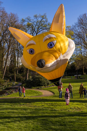 Ludwigsburg, Germany - March 23, 2024:A man inflates a balloon at a balloon festivalのeditorial素材