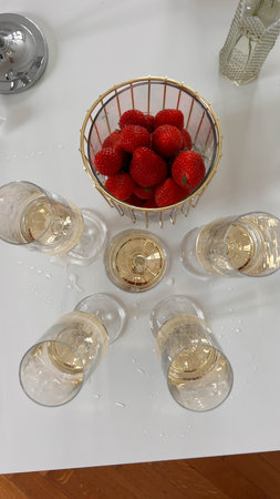 glasses of champagne with strawberriesの写真素材