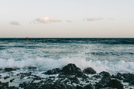 Canary Island, Tenerife-December14,2023.Man professional surfer standing on the sandy beach with his kite and board. Windsurfing, Extreme Sportのeditorial素材