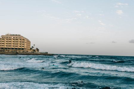 Canary Island, Tenerife-December14,2023. Men und girls surfers going for surfing in the ocean.のeditorial素材