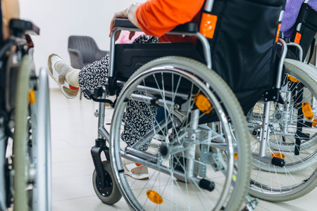 Senior woman in a wheelchair at a nursing home, looking content and engaged. High quality photo