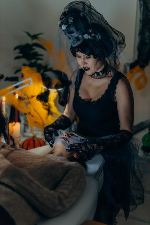 Cosmetologist in a Halloween costume at a beauty salon, holding skincare tools, festive atmosphere.の写真素材