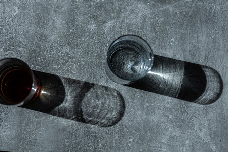 Close up pouring fresh drink water from the bottle on table in living room. High quality photoの写真素材