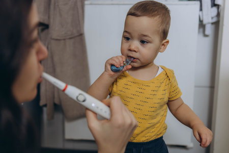 Dental care, mother brushing teeth with boy for wellness,Bathroom, oral health toothbrushの写真素材