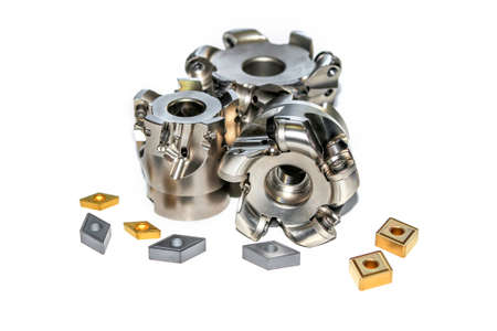 Closeup of two undamaged and one damaged indexable milling cutter for CNC milling machine with four...