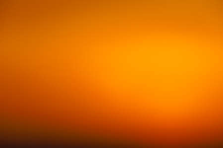 Blurred sunset sky. Abstract orange gradient colorful backgroundの写真素材