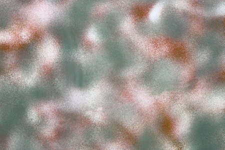 Texture of an old metal side of the military vehicle once painted for the camouflage effect as a backgroundの写真素材