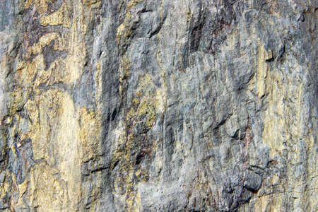 Texture of a colorful natural stone as a background