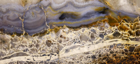 Texture of a colorful natural stone with layer structure as an abstract background