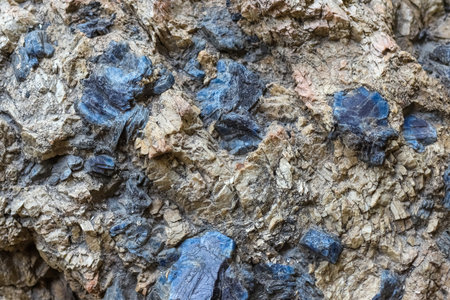 Closeup of texture of a colorful natural stone as an abstract geological background