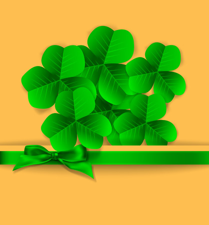 St. Patrick day card, bouquet of clovers and green bow on orange paper backgroundのイラスト素材